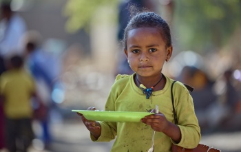 child eating Mary's Meals in Ethiopia