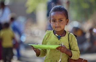 child eating Mary's Meals in Ethiopia