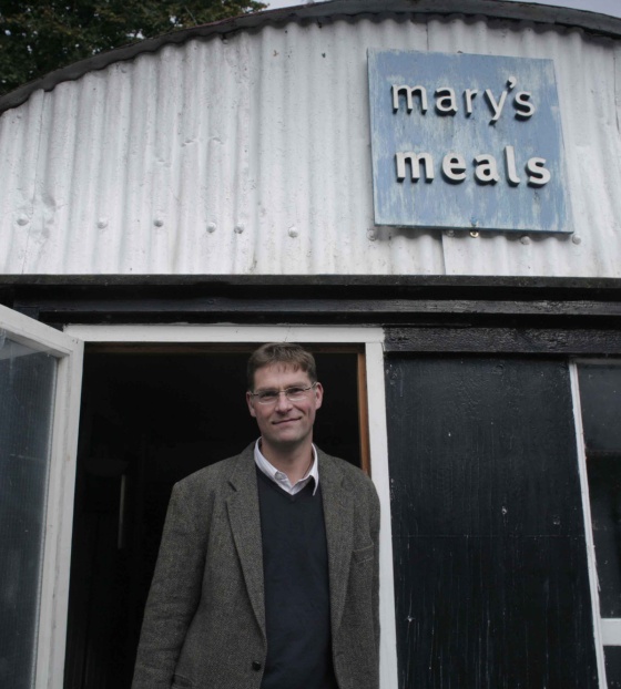 Mary's Meals founder, Magnus MacFarlane-Barrow standing outside The Shed, the global HQ of Mary's Meals. 